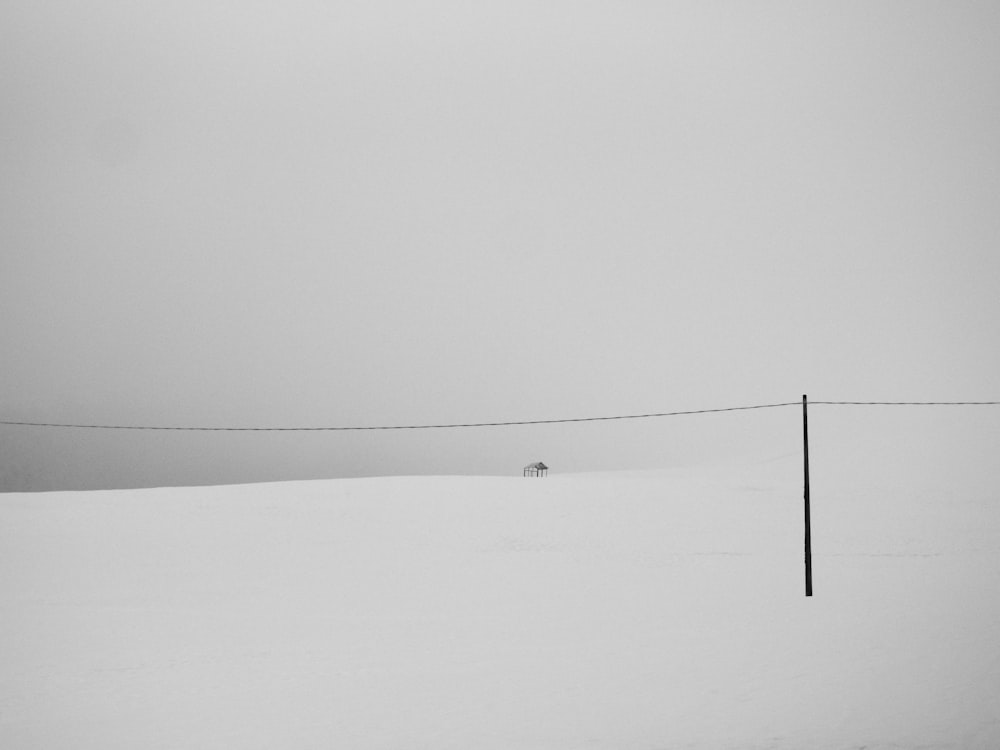 person walking on snow covered ground during daytime