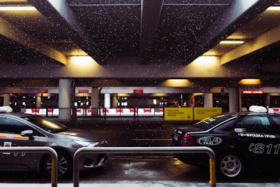 black sedan parked in parking lot