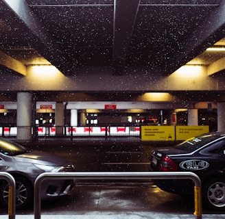 black sedan parked in parking lot