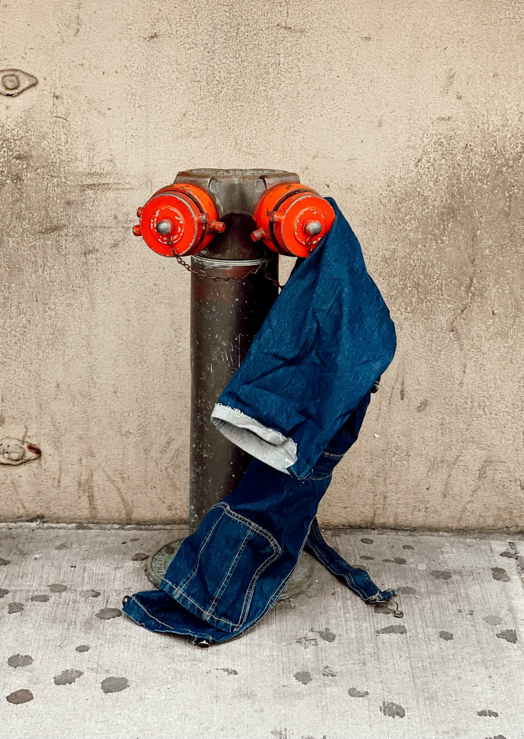 blue denim jeans on black and red binoculars