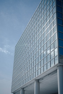 white and blue glass walled building