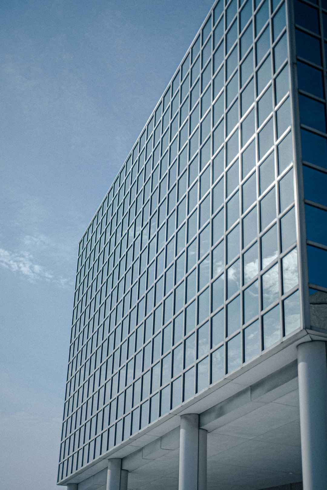 white and blue glass walled building