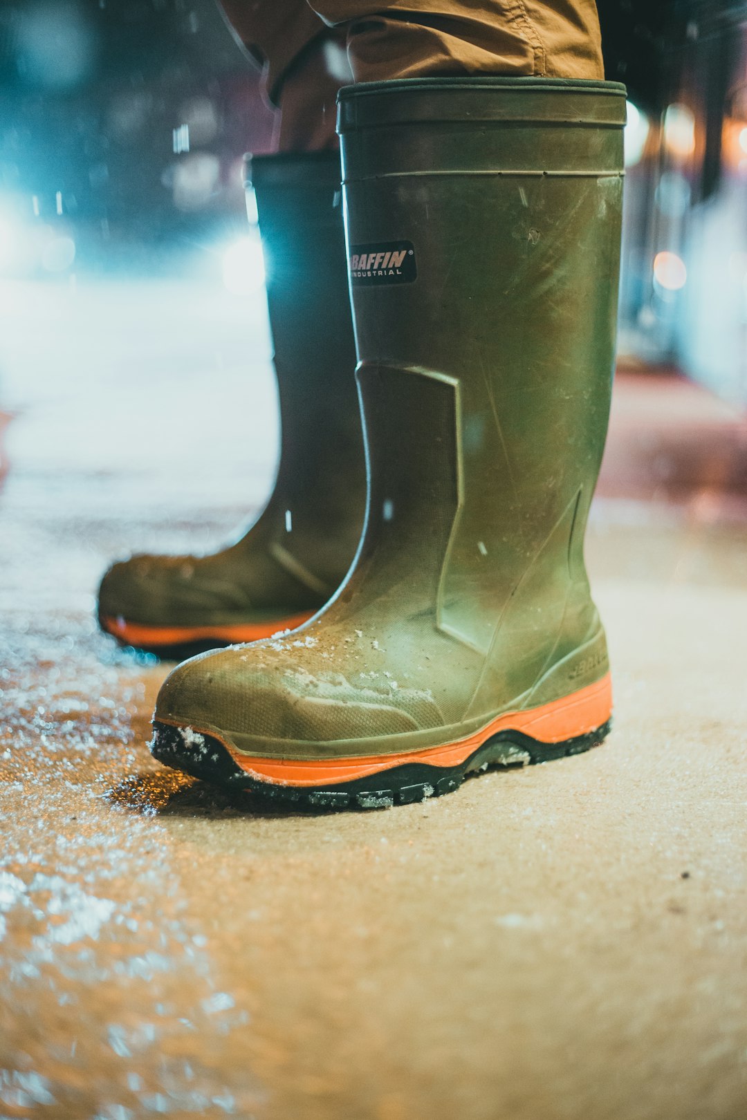 green leather boots on gray sand