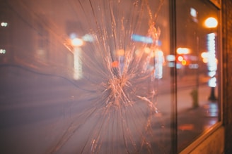 Close-up shot of a high-end modern window panel reflecting city lights.