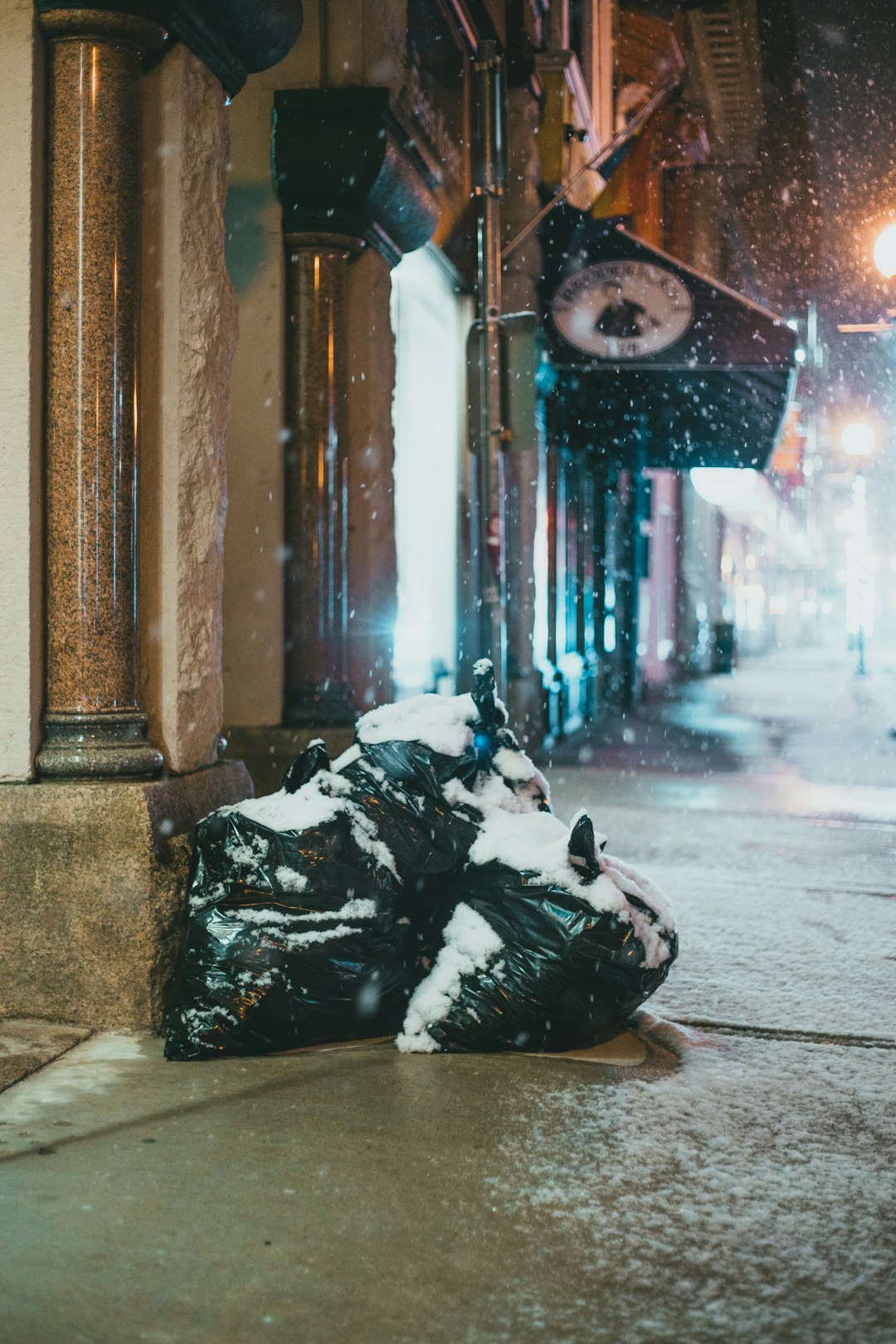 black plastic bag on gray concrete floor