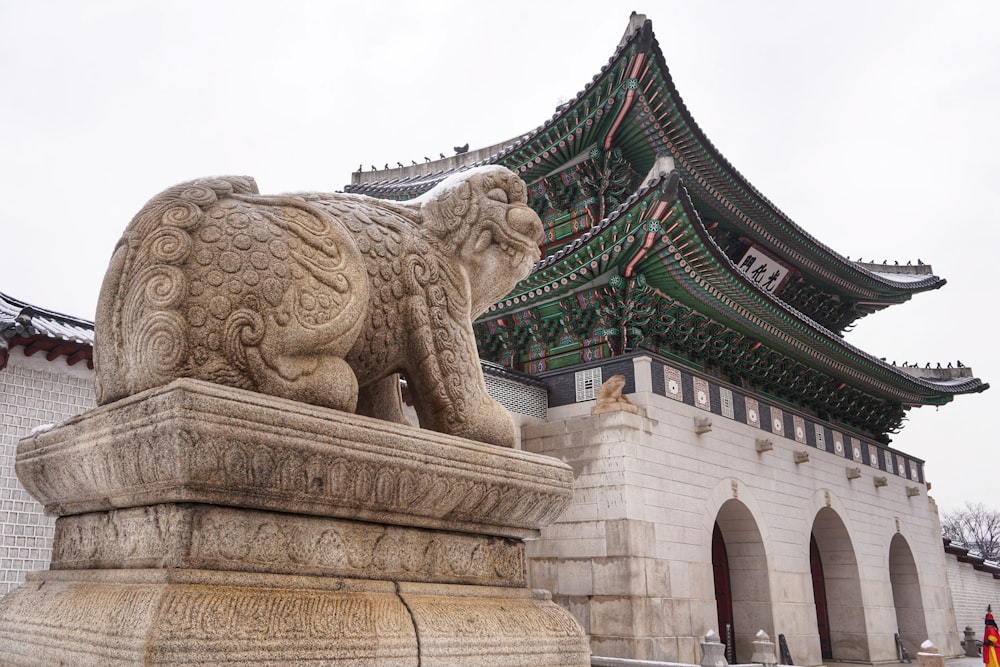 brown concrete dragon statue during daytime