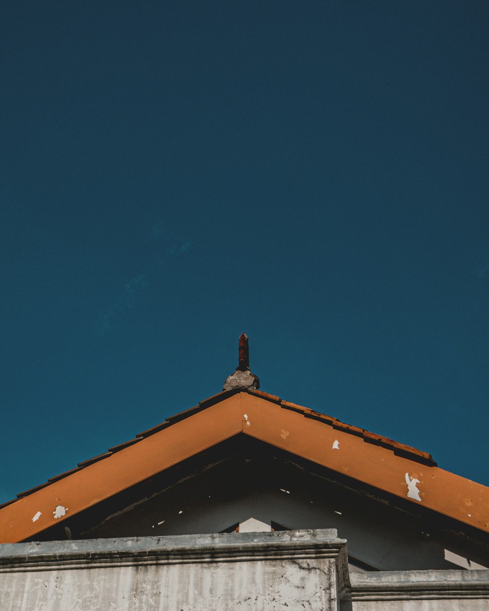 white and brown concrete house under blue sky during daytime