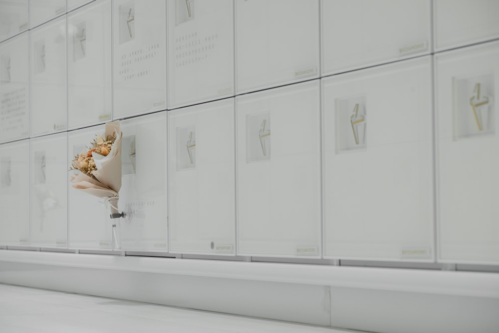 woman in white dress sitting on white bench