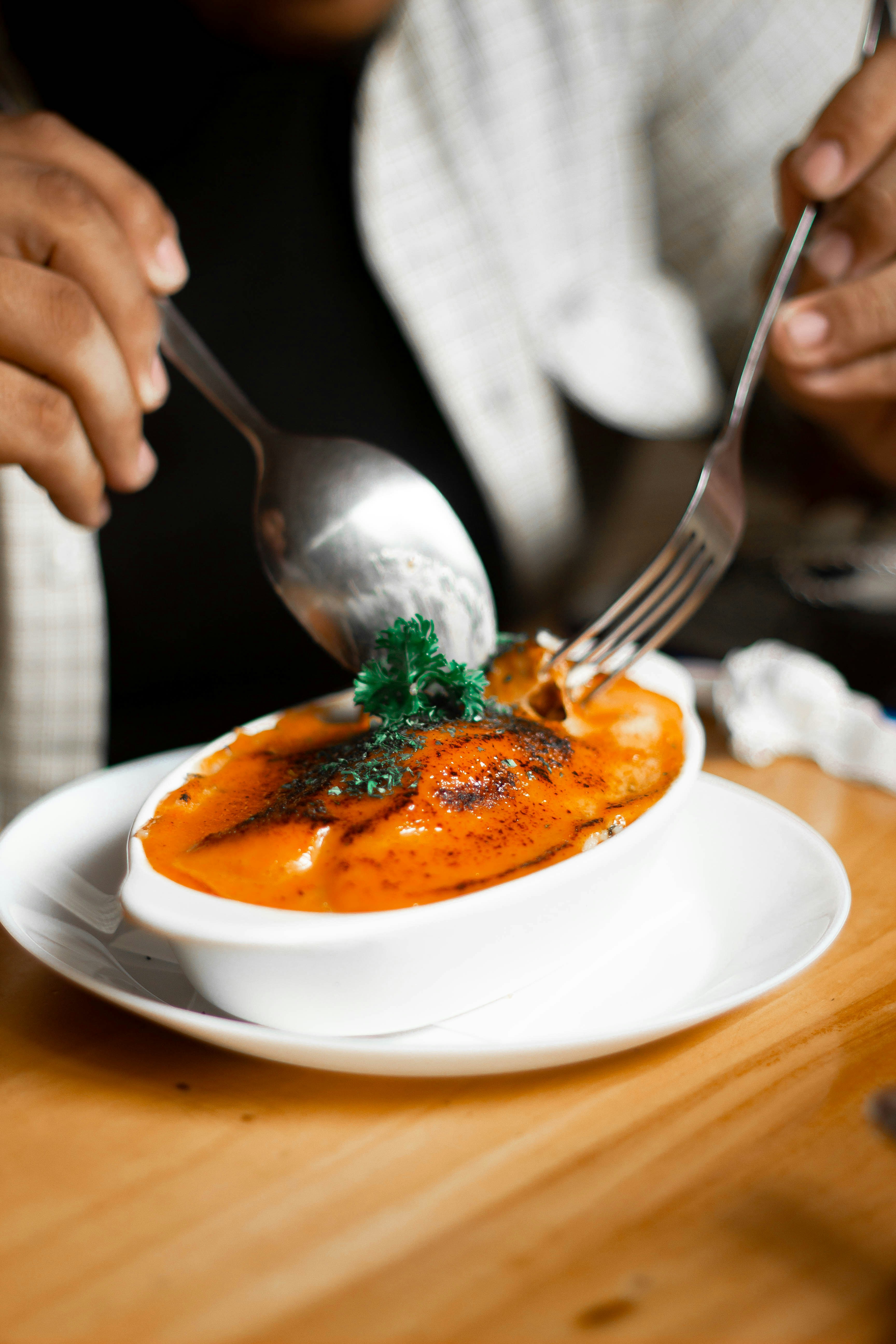stainless steel fork on white ceramic plate