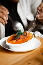 stainless steel fork on white ceramic plate