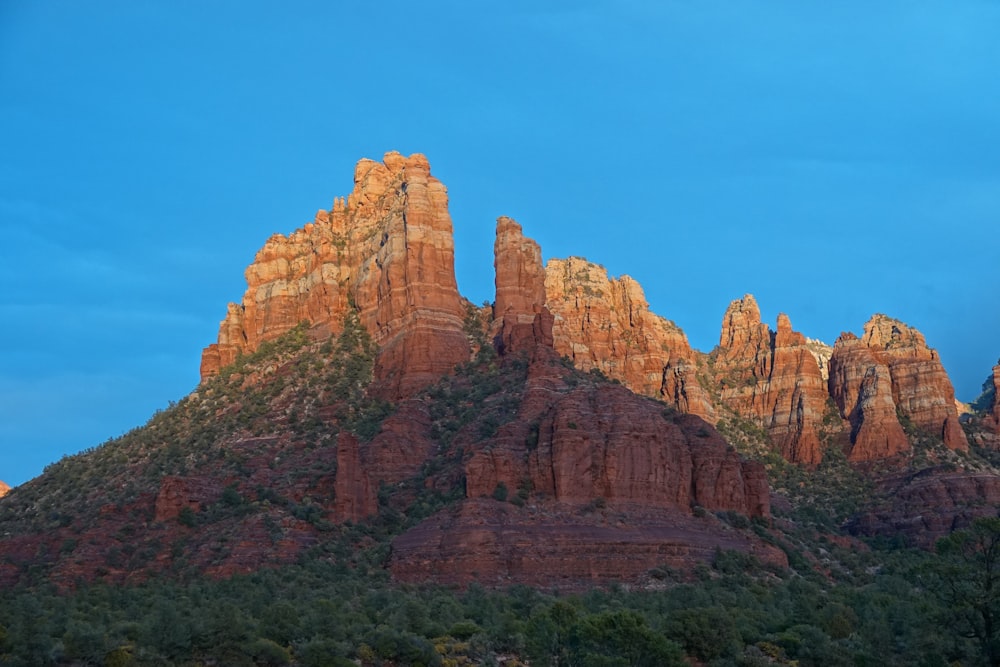 brown rock formation under blue sky during daytime