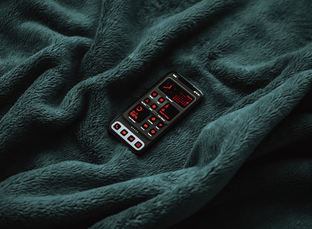 black remote control on blue textile