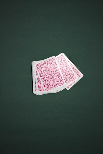 A deck of illustrated fantasy playing cards fanned out.