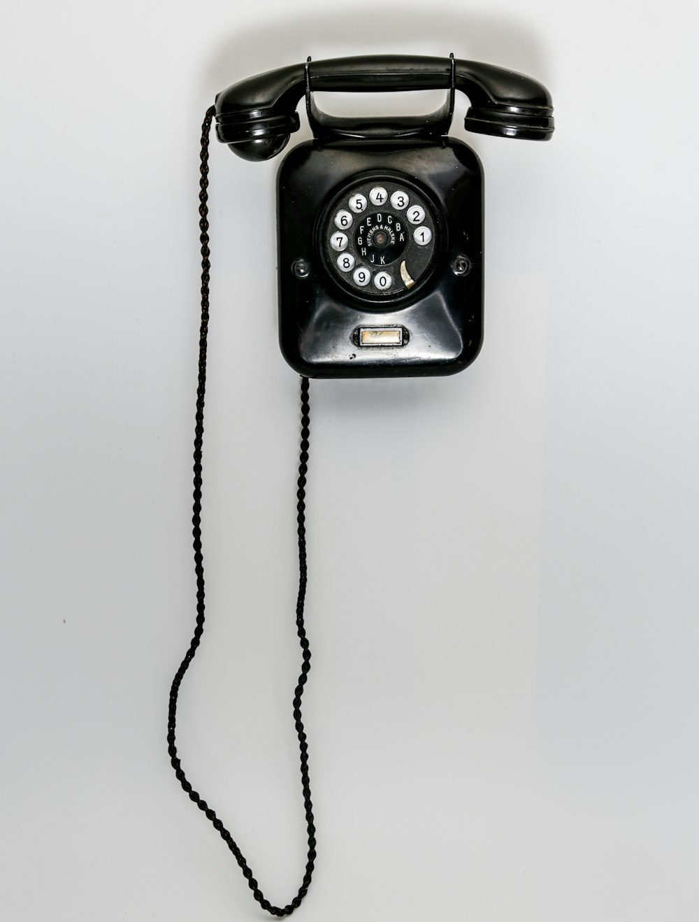 black and gray corded telephone