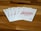 A set of playing cards is fanned out on a wooden surface, showing the 7, 6, 5, 4, and 3 of diamonds, with the 3 card prominently featured.