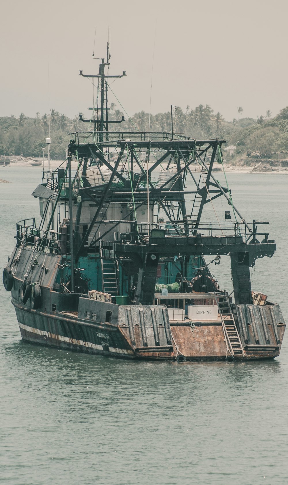 black and brown ship on sea during daytime