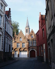 Crisp editorial-style shot of a European cobblestone street bathed in morning light.