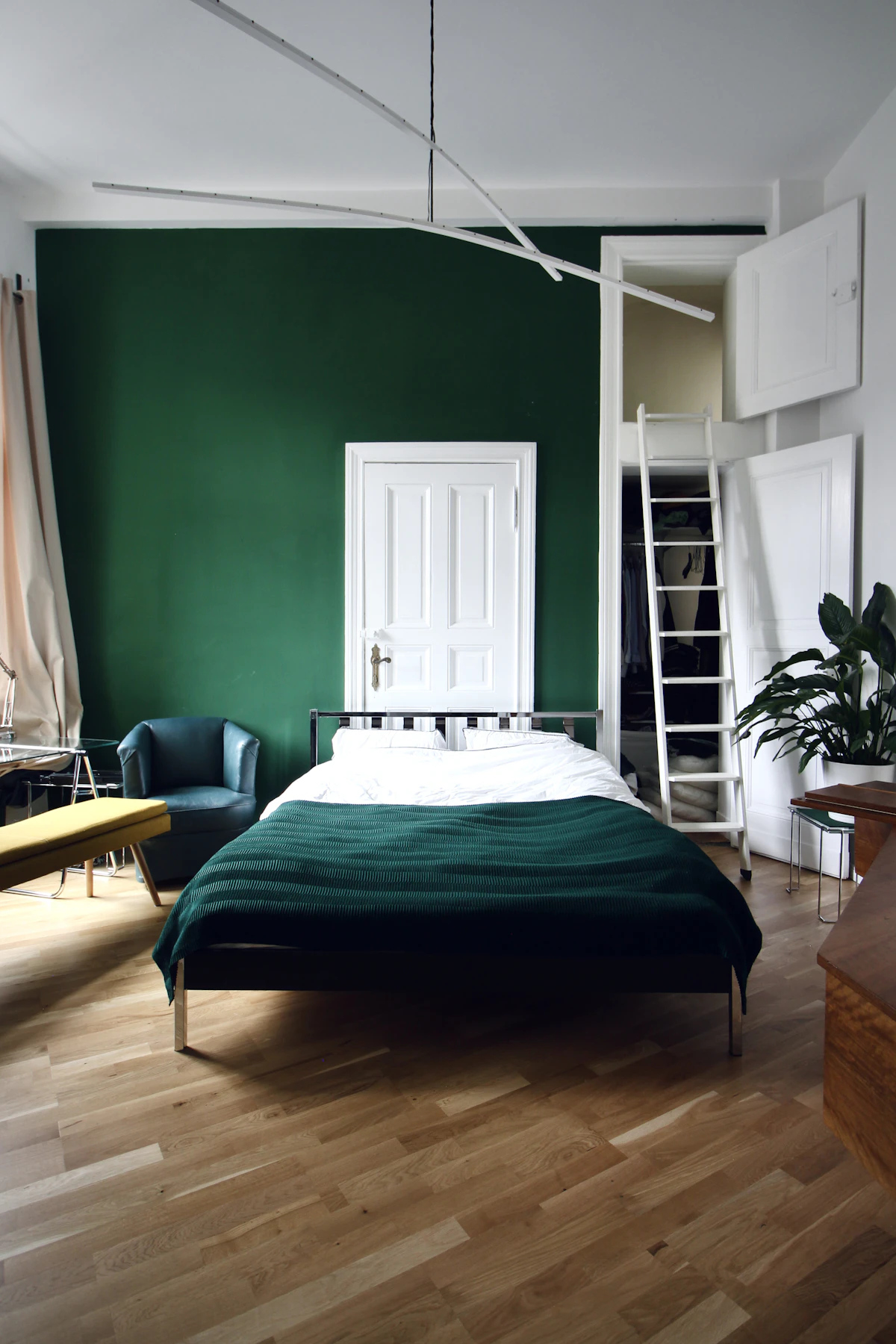 Bedroom corner with a plant and bedside table