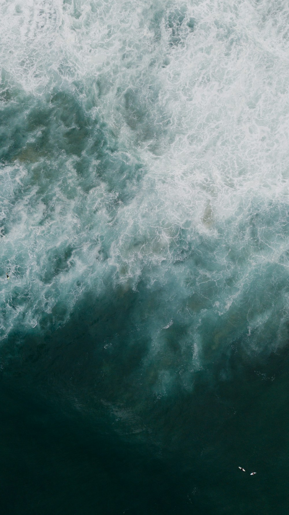 water waves on blue body of water during daytime