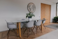 white and brown wooden table and chairs