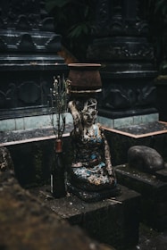 brown and black ceramic figurine