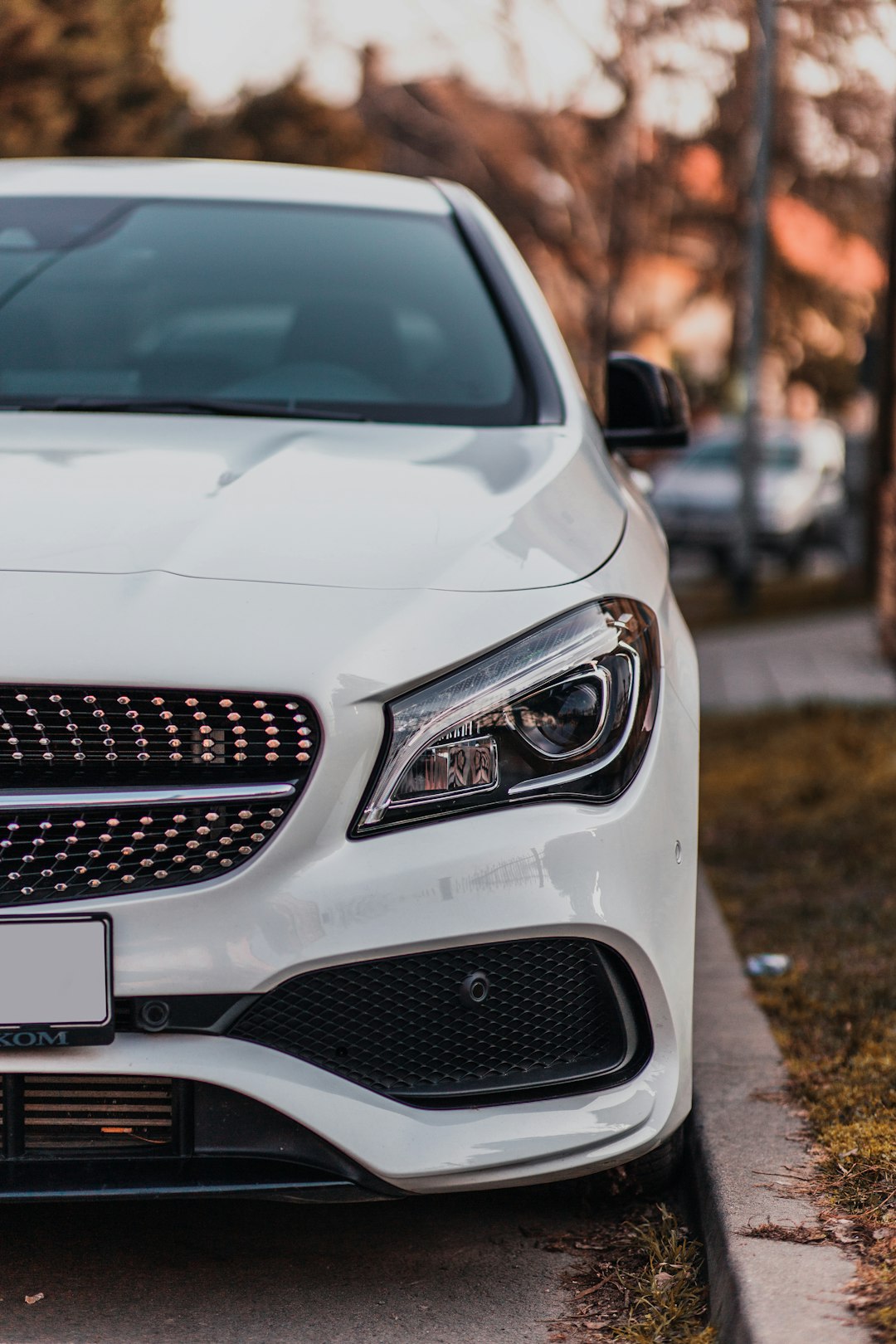 white mercedes benz car on road during daytime