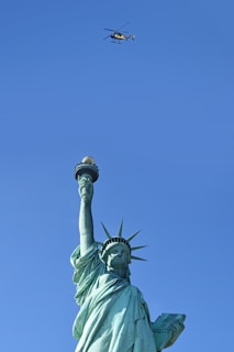 The Statue of Liberty framed by a clear blue sky, symbolizing opportunity in the USA.