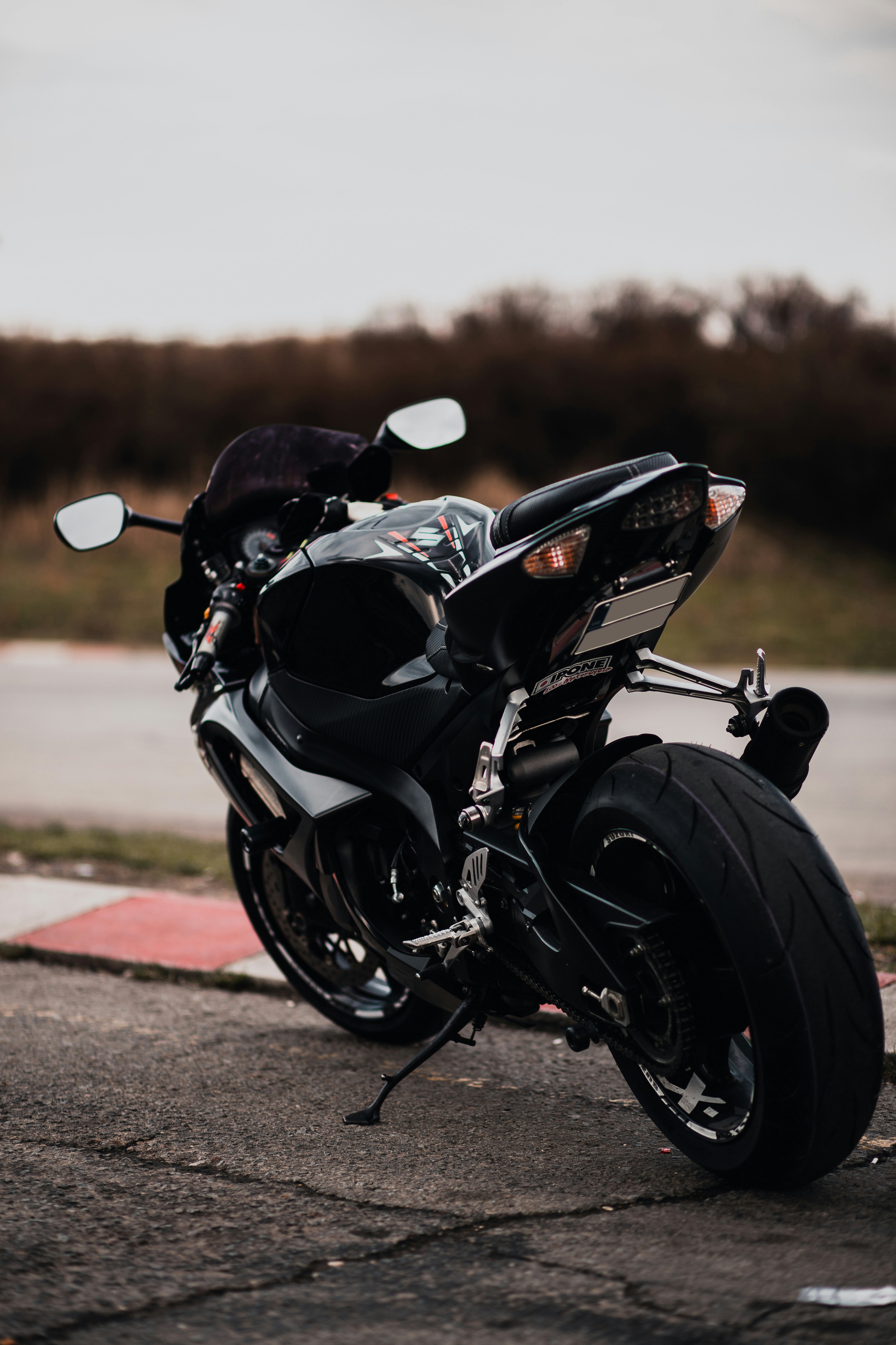 Black sports bike on brown dirt road during daytime photo – Free ...