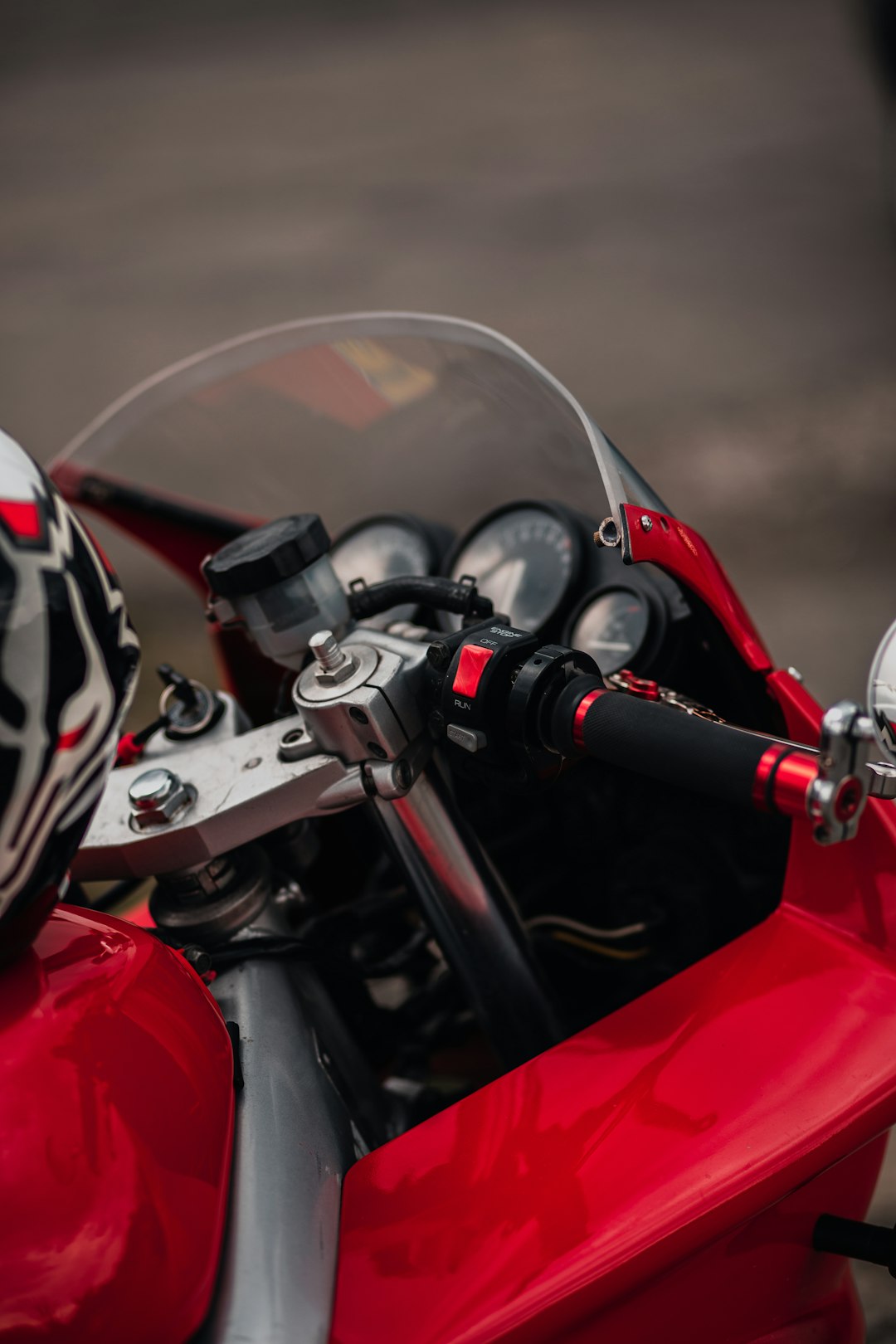 red and black motorcycle in close up photography