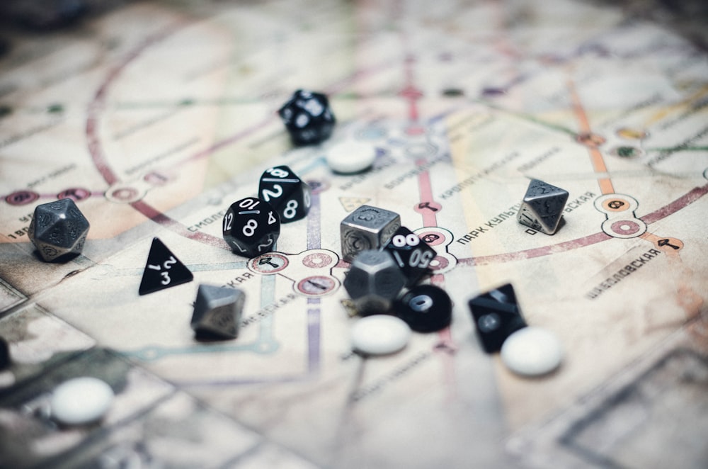 black and white dice on white and black textile