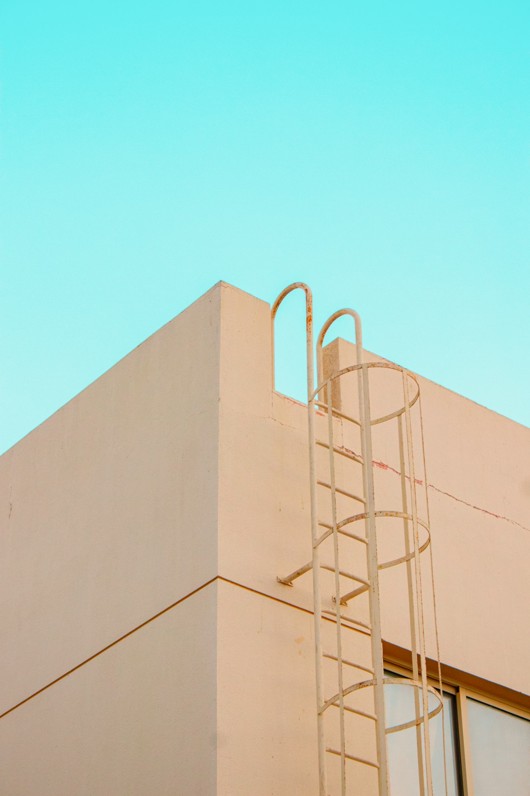 beige concrete building under blue sky during daytime