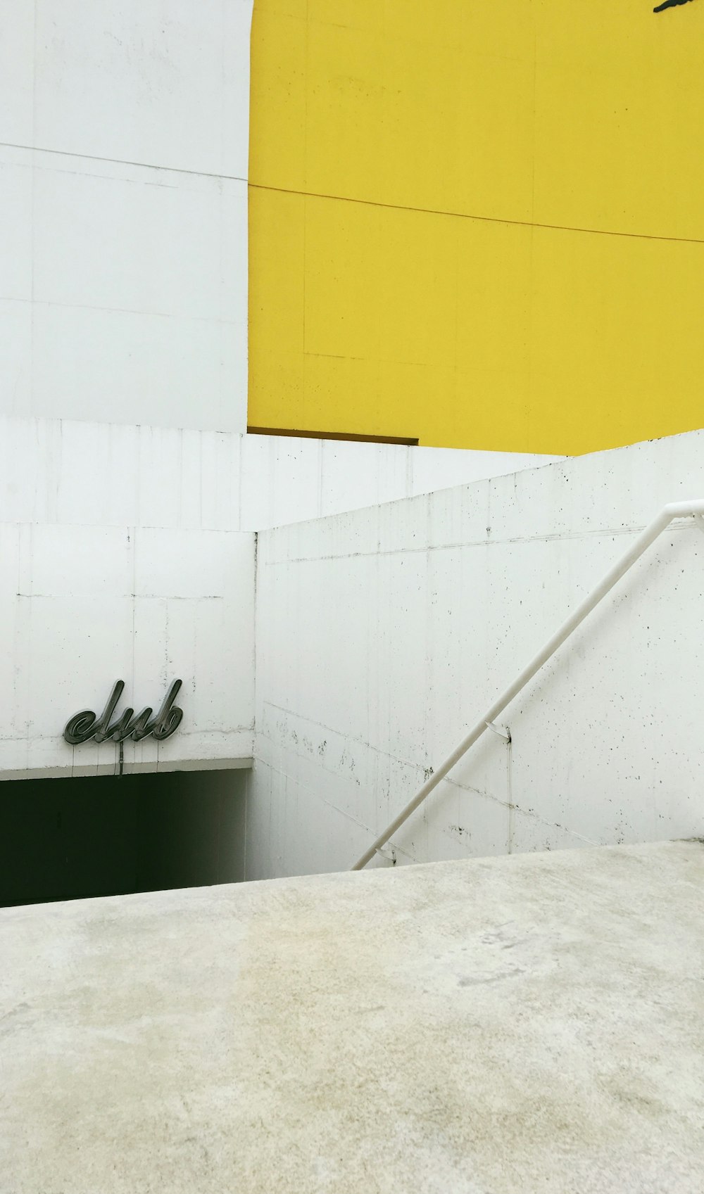 white and yellow concrete staircase