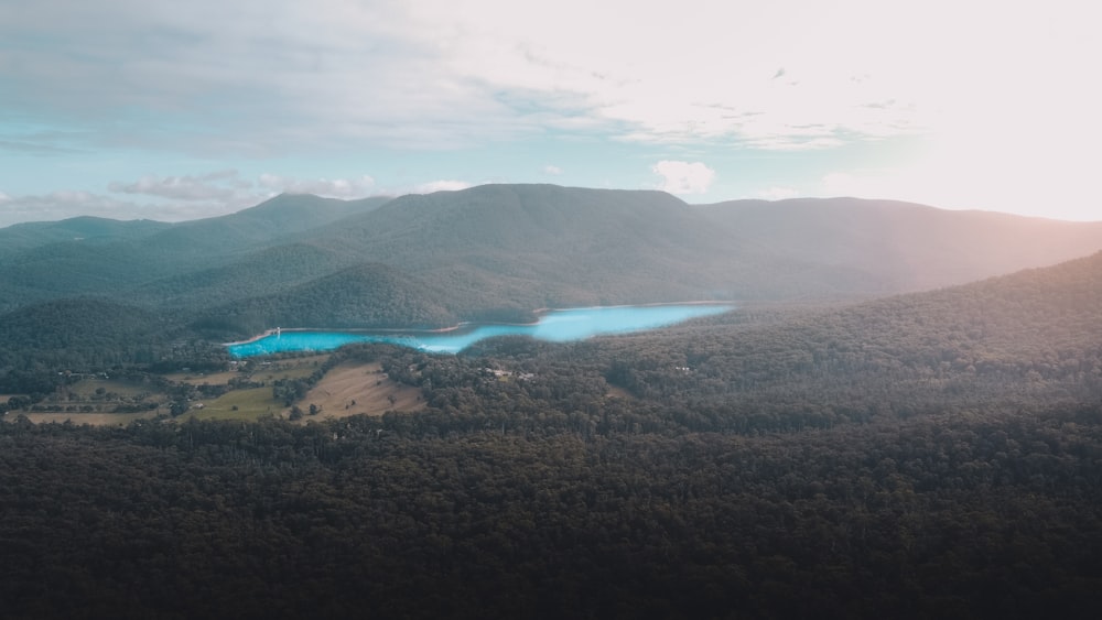 green mountains under white clouds during daytime