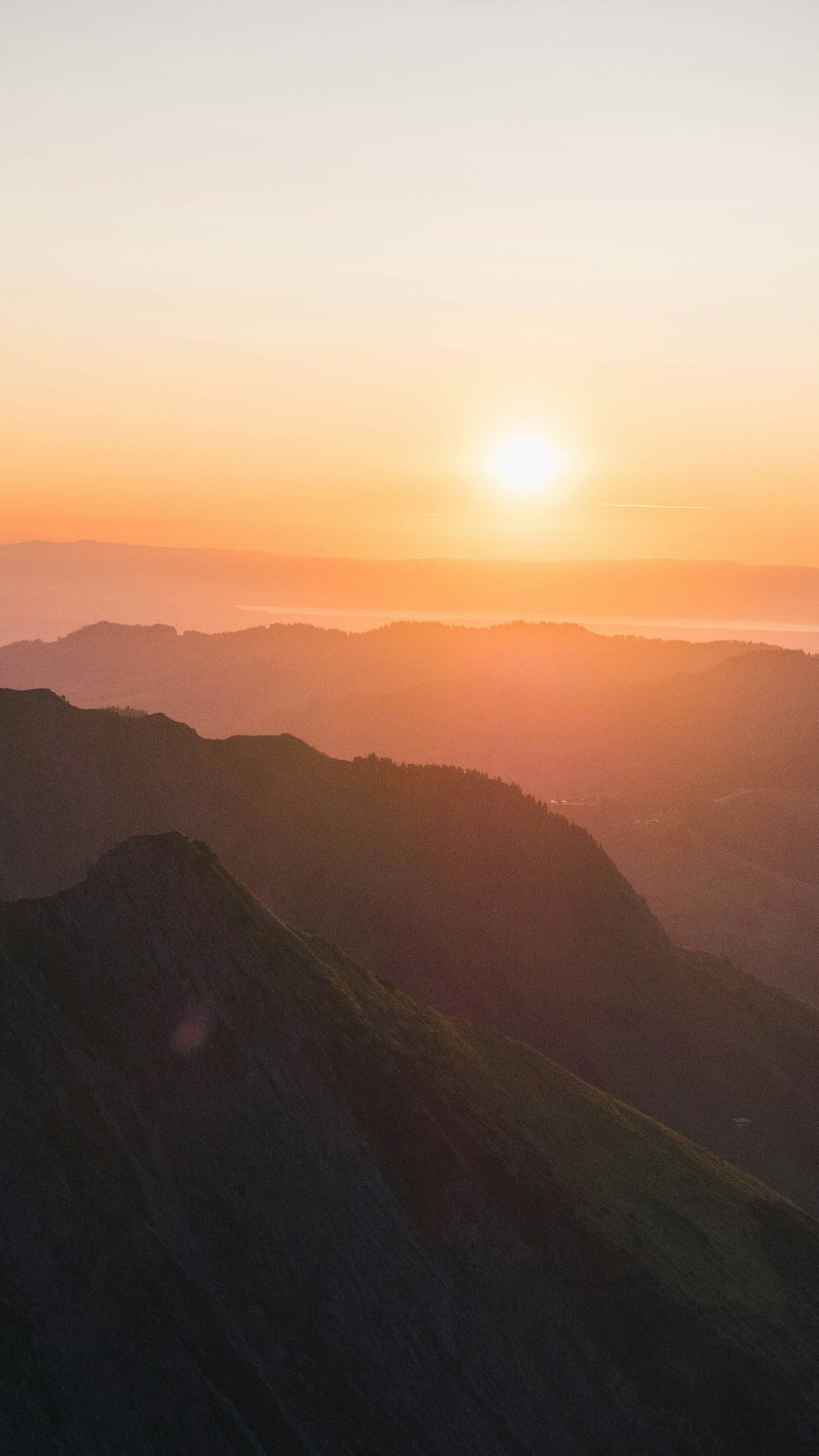 silhouette of mountains during sunset