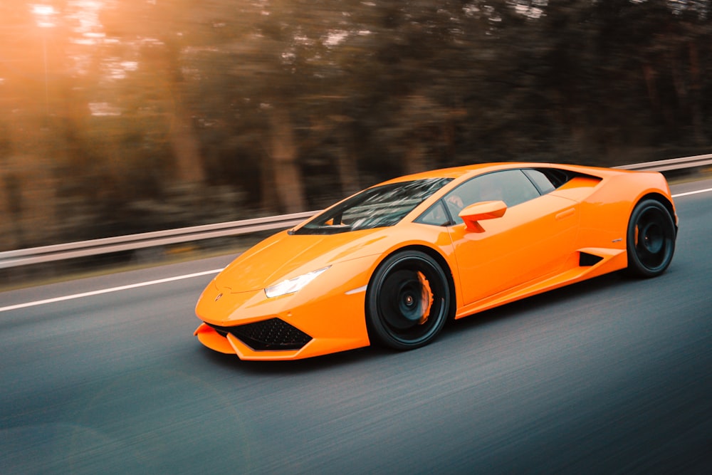 yellow lamborghini aventador on road during daytime