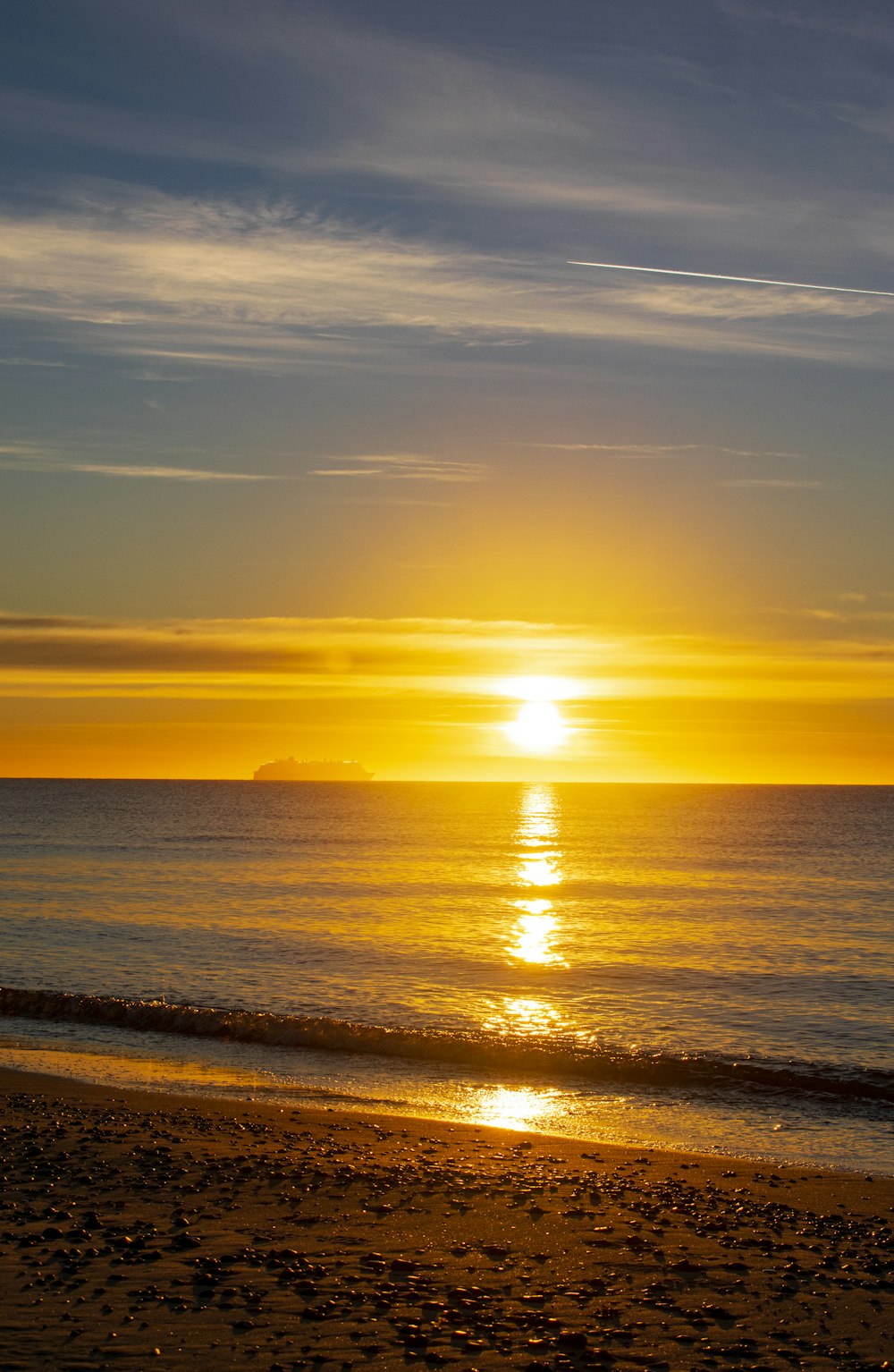 body of water during sunset