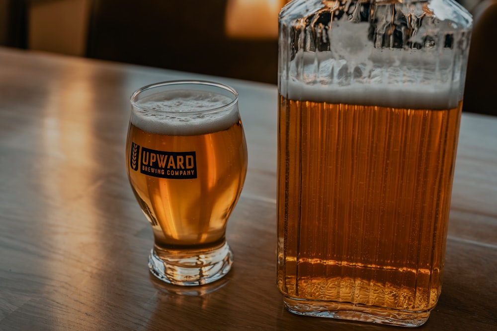 clear drinking glass with beer