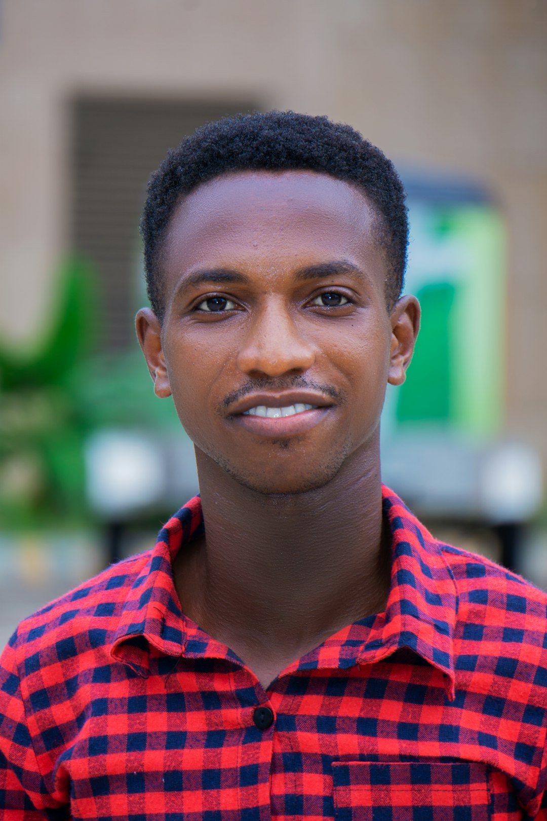 man in red and white checkered button up shirt