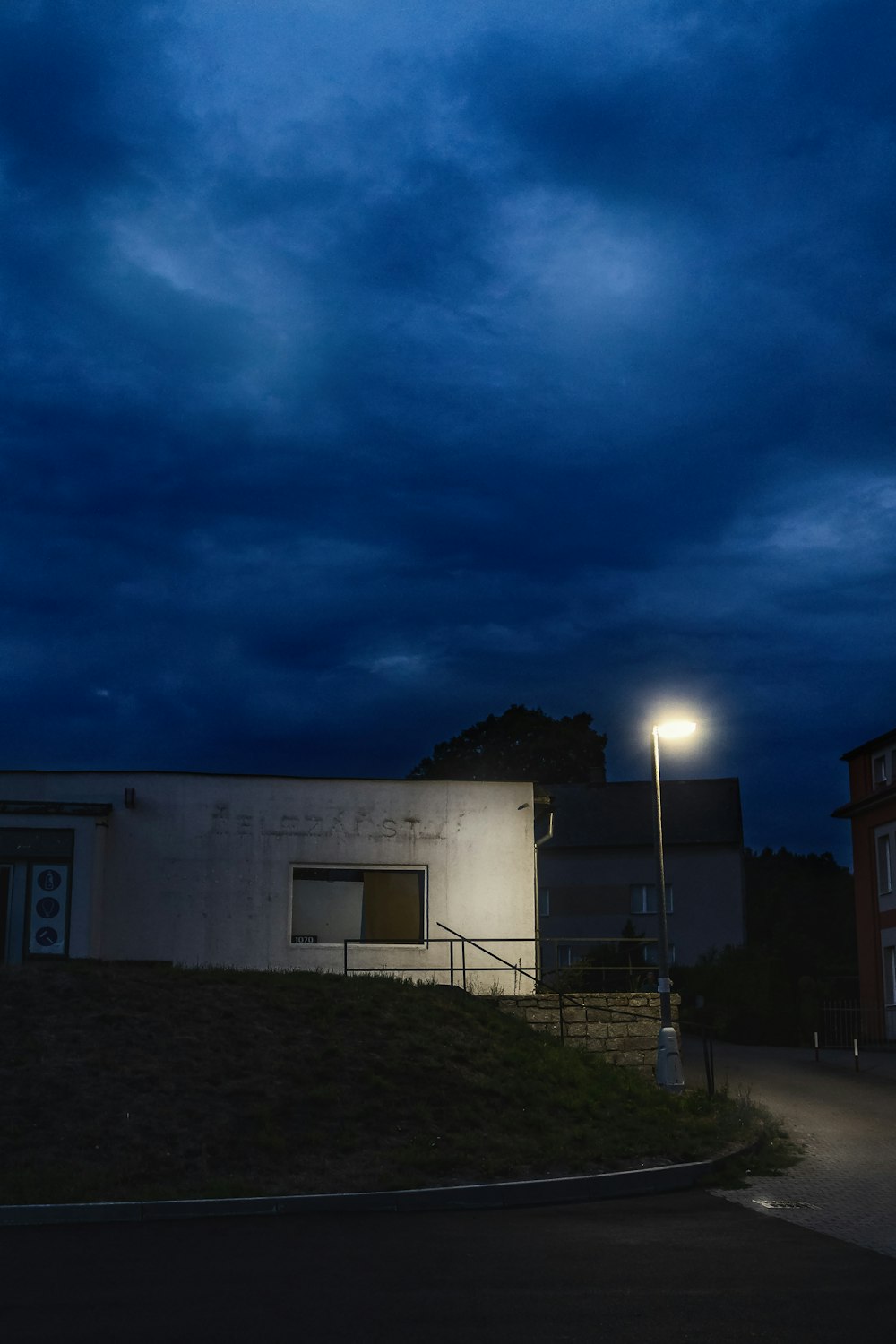 white concrete building under blue sky during night time