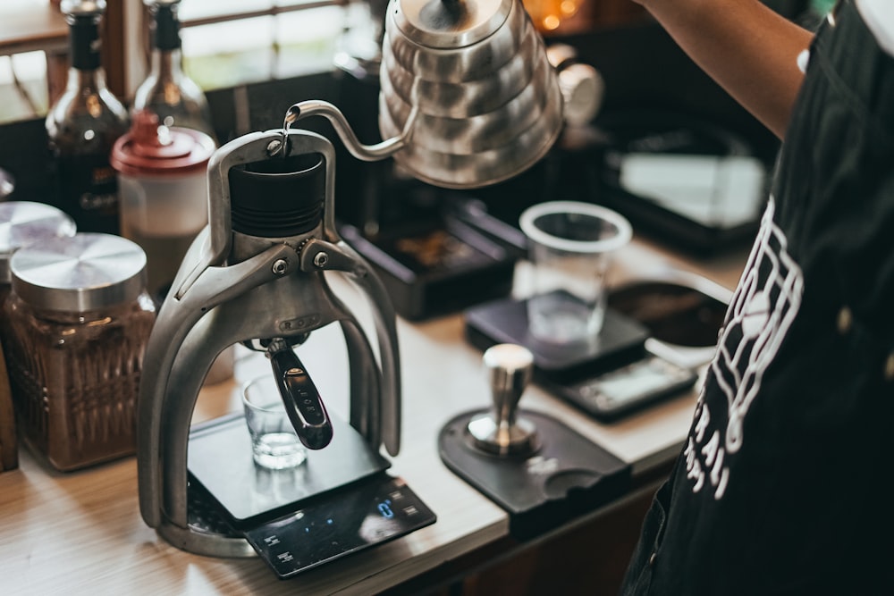 silver and black coffee maker