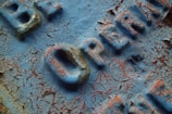A detailed view of a handcrafted wooden sign.