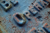 A detailed close-up of a handcrafted wooden sign.