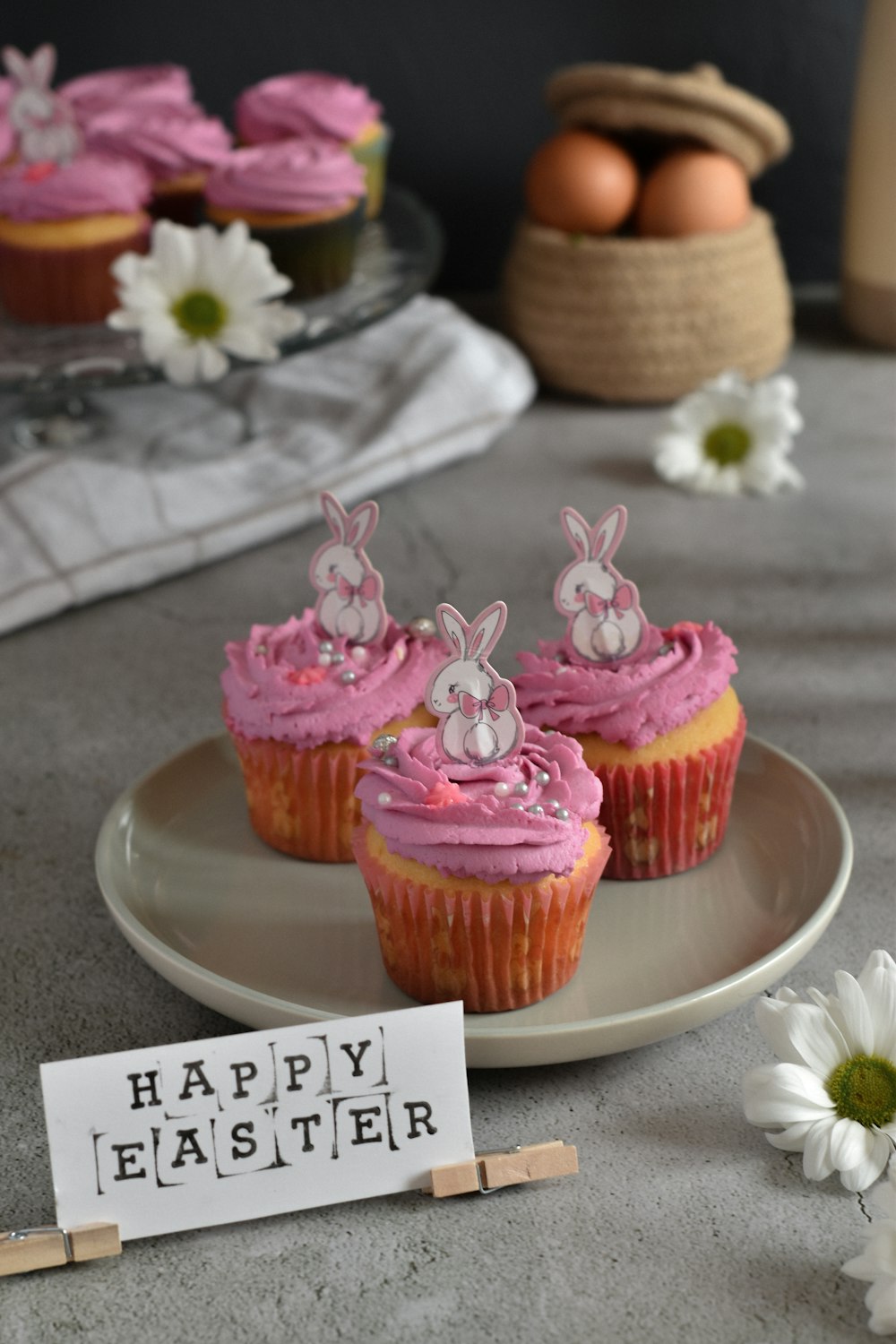 pink cupcake on white ceramic plate