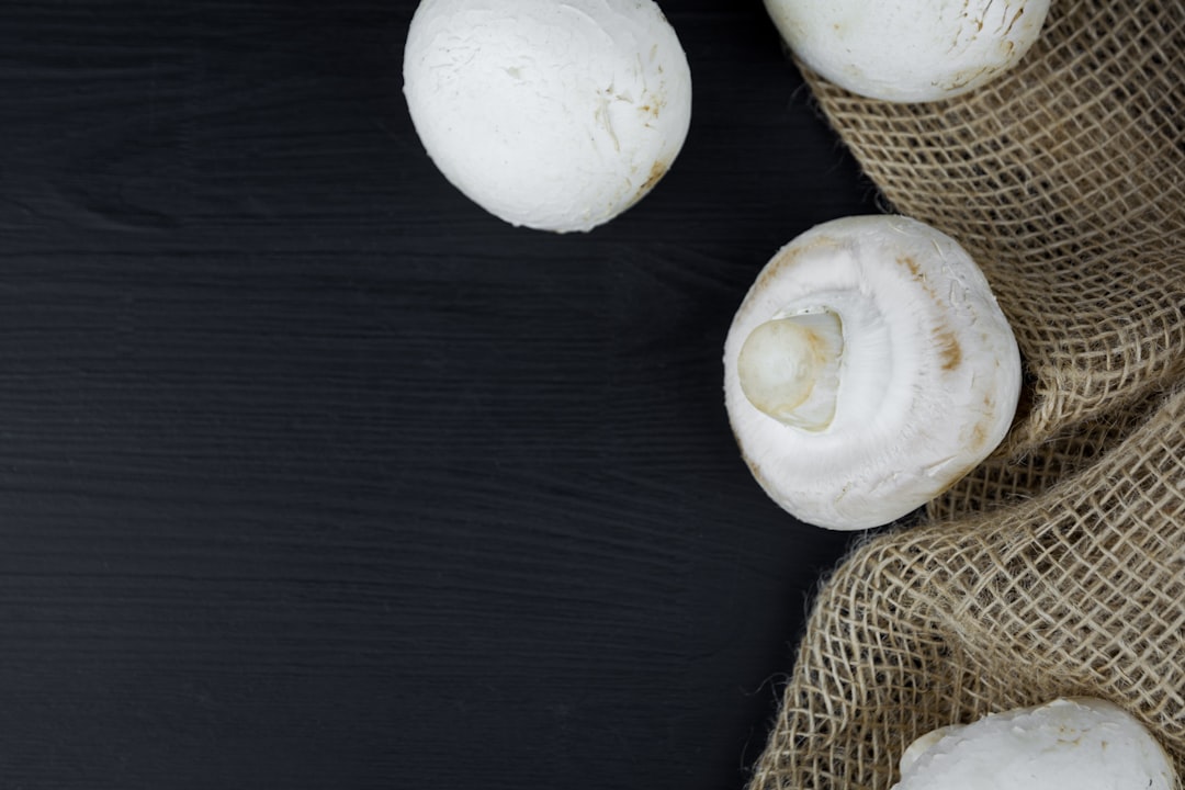 white garlic on black wooden table
