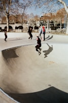 Skaters gathered around a freshly built bowl, sharing tricks and stories.