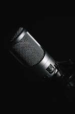 black microphone on black background