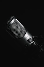 black microphone on black background