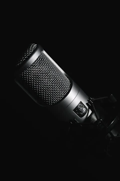 black microphone on black background
