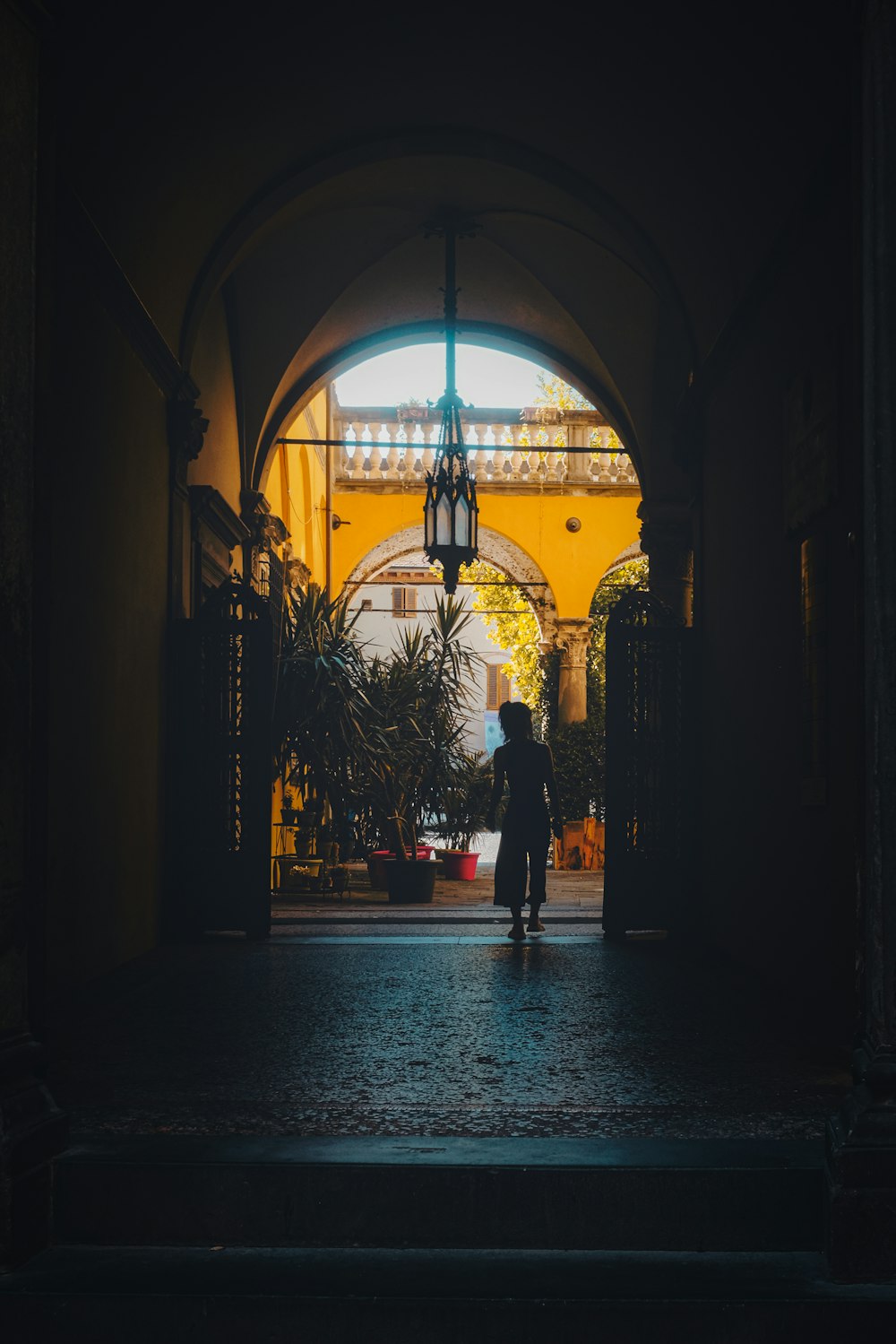 silhouette of person walking on hallway