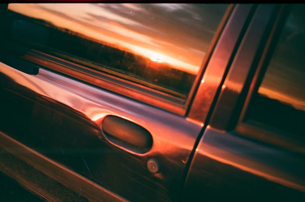 black car door with light reflection